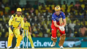 Csk vs rcb cameroon green and ms dhoni.jpg