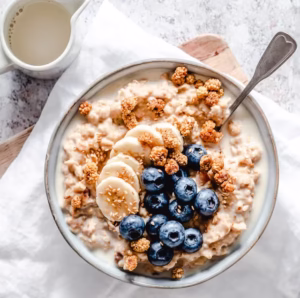 Creamy oatmeal bowl with banana blueberries royalty free image 1619015007 